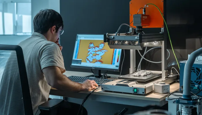 CIRCE technician working with a hyperspectral camera in the artificial vision laboratory.